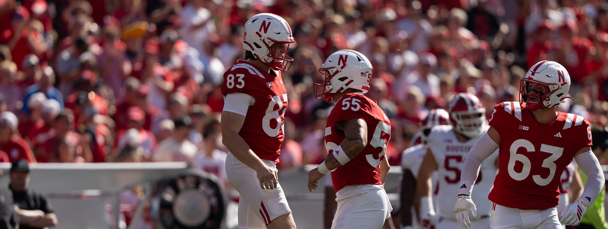 Archie Wilson celebrates with Jack Wills after a punt in a college football game.